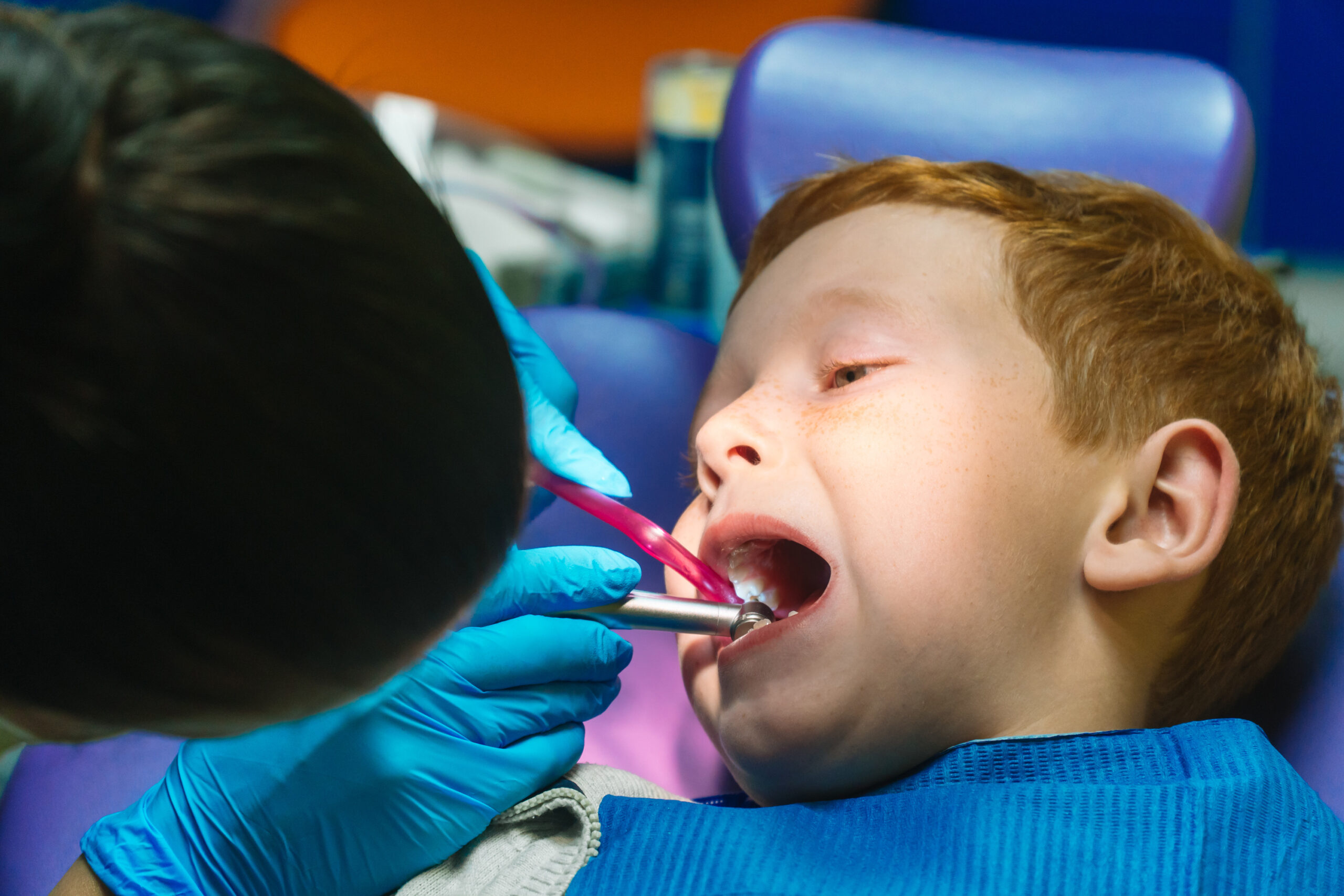 Scared young boy at the dentist after a dental emergency
